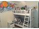 Bedroom with bunk beds, nightstand and whimsical mural at 7513 Marker Ave, Kissimmee, FL 34747