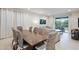 Open dining room features a large table with seating for six and overlooks the living room at 7513 Marker Ave, Kissimmee, FL 34747