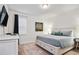 King-size bed and large dresser in this bedroom at 7513 Marker Ave, Kissimmee, FL 34747