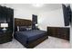 King-size bed, dark wood furniture, and mounted TV at 7513 Marker Ave, Kissimmee, FL 34747