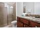 Bathroom with shower and granite vanity at 7513 Marker Ave, Kissimmee, FL 34747