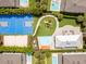 Aerial view of community amenities including a playground, basketball court and spray park at 7513 Marker Ave, Kissimmee, FL 34747