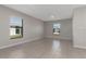 Spacious living room with neutral walls and tile floors at 208 Hyacinth Ct, Kissimmee, FL 34759