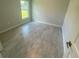 Simple bedroom with tile flooring and a window at 541 Rhodes Dr, Deland, FL 32720