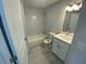 Clean bathroom with tub, toilet, and vanity at 541 Rhodes Dr, Deland, FL 32720