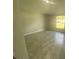 Bright bedroom with tile flooring and large window at 541 Rhodes Dr, Deland, FL 32720