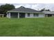 Large backyard with lush green grass at 541 Rhodes Dr, Deland, FL 32720