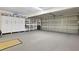 Spacious garage with ample storage shelving and flooring at 201 Weeping Elm Ln, Longwood, FL 32779