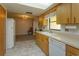 Kitchen with wood cabinets, tile floor, and stainless steel appliances at 331 Douglas Dr, Eustis, FL 32726