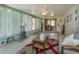 Sunroom features tiled floor, seating, and access to the outdoors at 331 Douglas Dr, Eustis, FL 32726