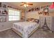 Cozy bedroom with a comfortable bed and charming decor at 331 Douglas Dr, Eustis, FL 32726