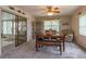 Dining area features a wood table, seating, and sliding glass doors at 331 Douglas Dr, Eustis, FL 32726