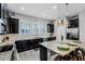 Modern kitchen with large island, granite countertops and stainless steel appliances at 3136 Porta Romano Way, Lake Mary, FL 32746