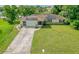 Aerial view of house with driveway and large yard at 1522 Gainesville Dr, Deltona, FL 32725