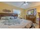 Bright bedroom with a king-size bed and dresser at 1522 Gainesville Dr, Deltona, FL 32725