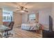 Cozy bedroom with built-in workspace and ceiling fan at 1522 Gainesville Dr, Deltona, FL 32725