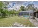 Relaxing backyard with refreshing pool and screened enclosure at 1522 Gainesville Dr, Deltona, FL 32725