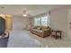 Living room featuring tiled floors, a couch, and a TV at 1522 Gainesville Dr, Deltona, FL 32725