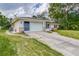 House exterior with solar panels and a large yard at 1522 Gainesville Dr, Deltona, FL 32725
