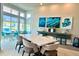 Community room features tables, chairs, and a pool view at 7770 Sandy Ridge Dr # 208, Reunion, FL 34747