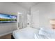 Bedroom with a queen bed and access to bathroom at 7770 Sandy Ridge Dr # 208, Reunion, FL 34747
