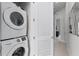 Convenient laundry room with stackable washer and dryer at 7770 Sandy Ridge Dr # 208, Reunion, FL 34747