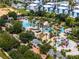 Aerial view of community pool, landscaping, and playground at 7770 Sandy Ridge Dr # 208, Reunion, FL 34747