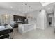 Modern kitchen with stainless steel appliances and an island at 7770 Sandy Ridge Dr # 208, Reunion, FL 34747