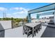 Spacious rooftop terrace with dining furniture and city views at 7770 Sandy Ridge Dr # 208, Reunion, FL 34747