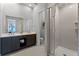 Modern bathroom with double vanity and walk-in shower at 7770 Sandy Ridge Dr # 208, Reunion, FL 34747