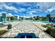 Resort-style pool with spacious deck and plenty of lounge chairs at 7770 Sandy Ridge Dr # 208, Reunion, FL 34747