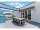 Relaxing rooftop terrace with lounge chairs and outdoor dining at 7770 Sandy Ridge Dr # 208, Reunion, FL 34747