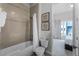 Bathroom with shower/tub combo and window at 7770 Sandy Ridge Dr # 208, Reunion, FL 34747