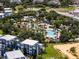 Aerial view of community pool and surrounding buildings at 7770 Sandy Ridge Dr # 208, Reunion, FL 34747