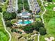 Aerial view of community pool and clubhouse near golf course at 7770 Sandy Ridge Dr # 208, Reunion, FL 34747