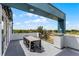 Enjoy city views from this private rooftop deck with outdoor dining at 7770 Sandy Ridge Dr # 208, Reunion, FL 34747