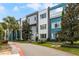 Modern building exterior with teal and gray accents at 7770 Sandy Ridge Dr # 208, Reunion, FL 34747