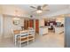 Bright dining area with a wooden table and view into the kitchen at 5006 Cub Lake Dr, Apopka, FL 32703
