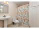 Clean bathroom with pedestal sink and shower/tub combo at 5006 Cub Lake Dr, Apopka, FL 32703