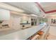 Open kitchen with ample counter space, stainless steel appliances, and pool view at 5006 Cub Lake Dr, Apopka, FL 32703