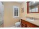 Clean bathroom with granite countertop, wood vanity, and shower/tub combo at 5006 Cub Lake Dr, Apopka, FL 32703