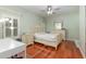 Charming bedroom with hardwood floors and a built-in desk at 5006 Cub Lake Dr, Apopka, FL 32703