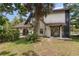 Side view of the house, showcasing the pool and patio area at 5006 Cub Lake Dr, Apopka, FL 32703