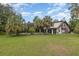 Large backyard with a pool and lush landscaping at 5006 Cub Lake Dr, Apopka, FL 32703