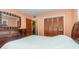 Bright bedroom with double bed, dresser, and large closet at 5006 Cub Lake Dr, Apopka, FL 32703