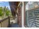 Charming balcony with wood door and diamond-pane window at 5006 Cub Lake Dr, Apopka, FL 32703