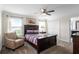 Bedroom with a double bed, armchair, and ceiling fan at 1224 Challenge Dr, Davenport, FL 33896