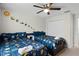 Themed bedroom with two twin beds and space-themed decor at 1224 Challenge Dr, Davenport, FL 33896