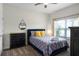 Cozy bedroom with a queen bed and large window at 1224 Challenge Dr, Davenport, FL 33896