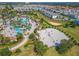 Community boasts a large pool area, sandy beach volleyball court, and lush green spaces at 1224 Challenge Dr, Davenport, FL 33896